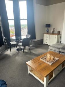 a living room with a coffee table and a couch at Castle Mount in Lincoln