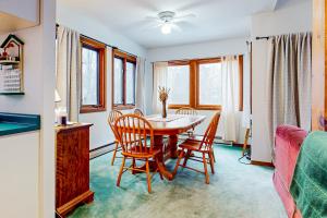 a dining room with a table and chairs at A Very Vermont Vacation in Jamaica