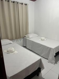 Ένα ή περισσότερα κρεβάτια σε δωμάτιο στο PARAISO DAS ÁGUAS - CHALÉ +10 φωτογραφίες