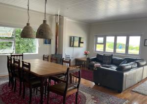 a living room with a table and a couch at SEA-la-vie in Gouritzmond