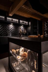 a kitchen with a black counter and a sink at PORTAL WYSOWA in Wysowa-Zdrój