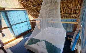 Una cama o camas en una habitación de Cayuco Maya
