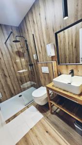 a bathroom with a toilet and a sink at B&B President in Zagreb +25 photos