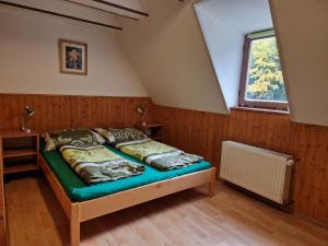 Postel nebo postele na pokoji v ubytování Šumavská Barborka