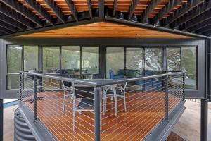 a screened in porch with a table in a house at Sandy Point Beach Escape 1 Bedroom Apartment in Sandy Point