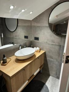 a bathroom with a sink and a mirror at Studio Rezistenta in Făgăraş +27 photos