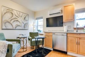 a living room with a kitchen with a dishwasher at Walkable Downingtown Studio with Spacious Deck in Downingtown