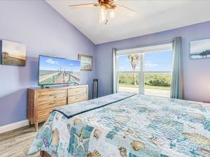 a bedroom with a large bed and a large window at Bayfront Kontiki 704 in Rockport +14 photos