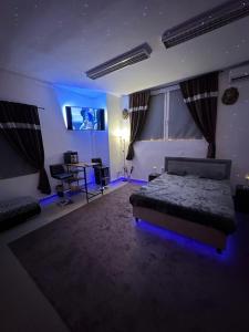 a bedroom with a bed and a tv in it at Relax studio Cheb in Cheb