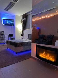 a bedroom with a bed and a fireplace at Relax studio Cheb in Cheb