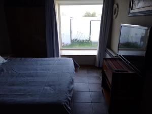 Katil atau katil-katil dalam bilik di La Laguna - Casa familiar a 5 cuadras de la playa.