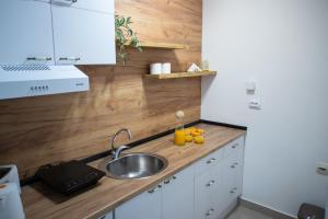 A cozinha ou kitchenette de Apartman Elle