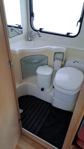 a bathroom with a toilet in the back of a rv at Autocarabana Ford trigano in Arrecife