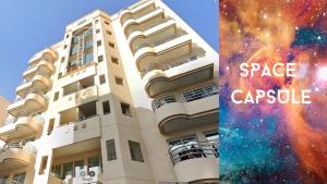 a building with the words space capsule next to it at Star Capsule Hostel Near Burjuman Metro Station in Dubai