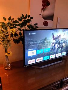 a flat screen tv sitting on top of a table at Residence Cuore in Caserta