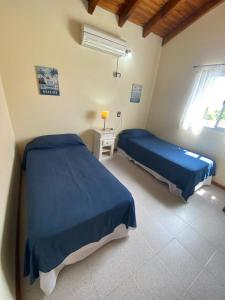 Ένα ή περισσότερα κρεβάτια σε δωμάτιο στο Duplex "PAUMARAN" a 100mts del mar y 550mts de peatonal