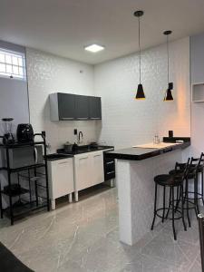 A kitchen or kitchenette at Kitnet Cidade de Goiás - Go #02
