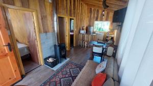 an overhead view of a living room with a stove at Cabañas & Habitaciones Del Alto in Hornopiren