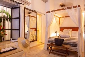 Postel nebo postele na pokoji v ubytování Leones de Alba Hotel Boutique