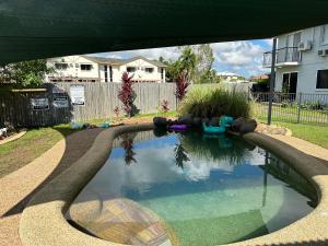 a swimming pool in a yard with a pool at Holiday at Henry St West End, Townsville QLD 3 night min in North Ward