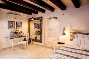 Postel nebo postele na pokoji v ubytování Leones de Alba Hotel Boutique