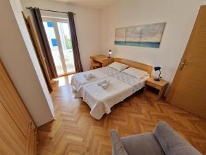 Postel nebo postele na pokoji v ubytování APARTMENTS JOSIPA