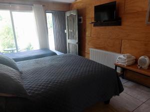 Voodi või voodid majutusasutuse Verdevida Apart Hotel toas
