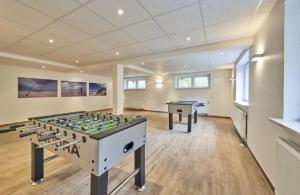 a large room with a foosball table in it at Op de Geest 10 in Cuxhaven