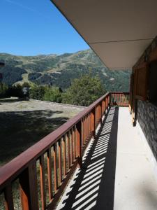 a balcony with a view of the mountains at Chandonnelles 8 in Mussillon