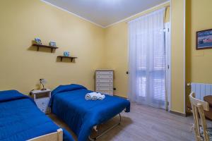 Posteľ alebo postele v izbe v ubytovaní Casa da Flo'