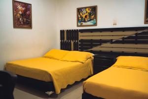 Ένα ή περισσότερα κρεβάτια σε δωμάτιο στο Hotel Raíces Casona Real