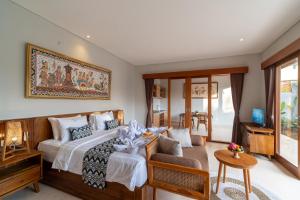 Postel nebo postele na pokoji v ubytování Narada Suite & Villa