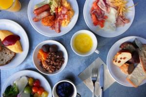 a bunch of plates of food on a table at THE KNOT TOKYO Shinjuku in Tokyo