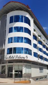 a building with a sign on the side of it at Gran Hotel Palmeras in Jaén