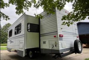 un rimorchio è parcheggiato in un garage di Happy Camper - Close to Mackinac Island a Carp Lake
