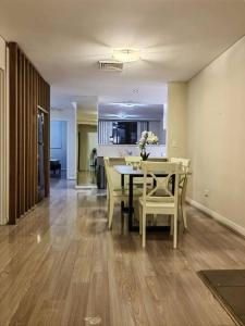 a dining room and kitchen with a table and chairs at Entire 3 bed apartment in Ryde in Sydney