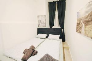 a small room with a bed in a bedroom at Comfortable Rooms in AKH Area in Vienna