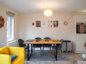 a dining room with a table and chairs at The Old Stables in Presteigne