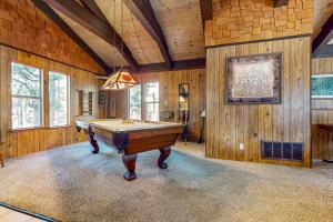 a pool table in a room with wooden walls at Donner Escape in South Lake Tahoe