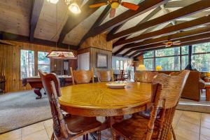 a dining room with a wooden table and chairs at Donner Escape in South Lake Tahoe