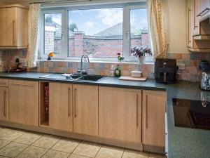 a kitchen with a sink and a window at Kempton House in Lincoln