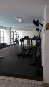 a gym with several tread machines in a room at Apartamento Frente Lagoa - RJ in Rio de Janeiro