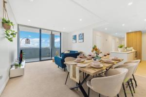 a dining room and living room with a table and chairs at Entire apartment in Arncliffe in Sydney