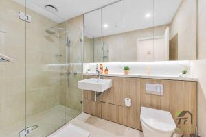 a bathroom with a toilet and a sink and a shower at Entire apartment in Arncliffe in Sydney