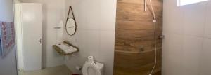 a bathroom with a toilet and a sink at Pousada Le Sorelle ap04 in Rosário do Sul +16 photos