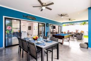 a dining room with a table and ping pong ball at Casa Emma - Oasis Playa Potrero in Playa Flamingo