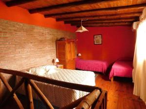 Giường trong phòng chung tại Dúplex PIRULO