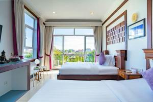 Kampot View Boutique客房内的一张或多张床位