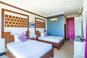 Kampot View Boutique客房内的一张或多张床位