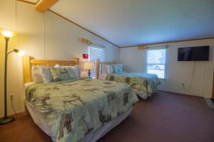 Ένα ή περισσότερα κρεβάτια σε δωμάτιο στο Stay in Ohiopyle in the center of it all, Ohiopyle, PA
